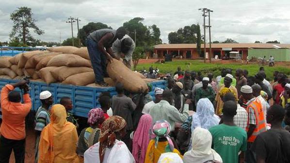 A local faith community unloads food aid in Tamale, Ghana
